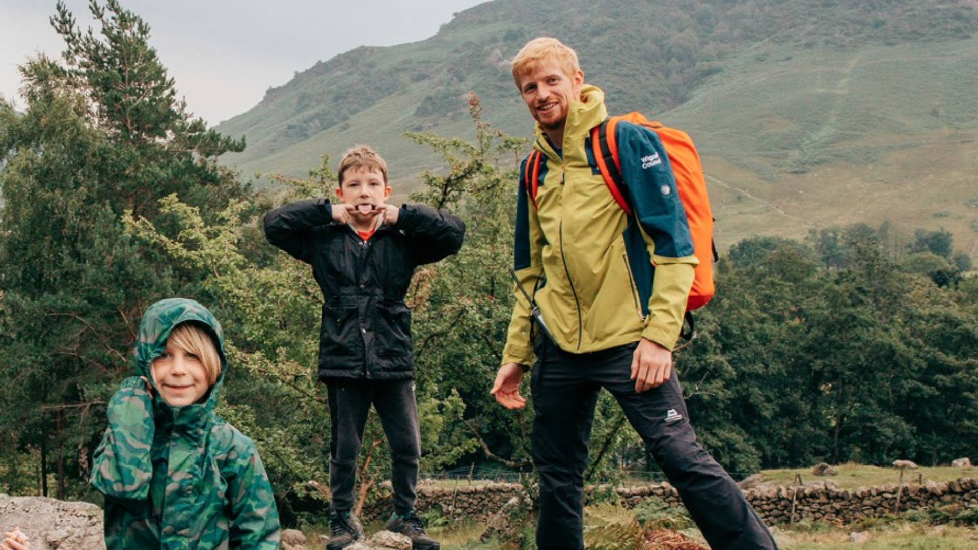 Two children and a man on a hike