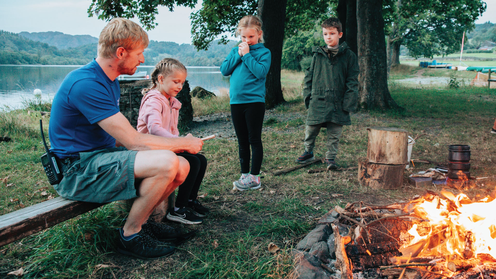 A family next to a log fire