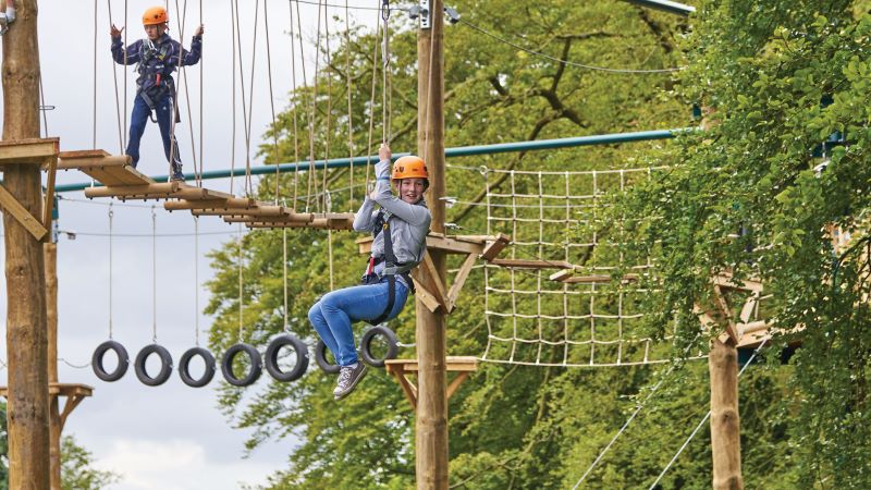 A young girl on high ropes