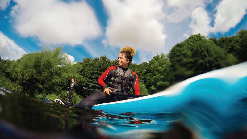 A girl on a paddle board