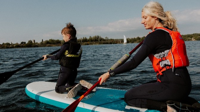 Two people paddleboarding